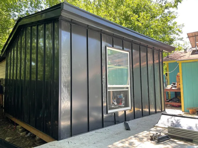 Black standing seam metal wall panels for Roof Inspection in Wylie