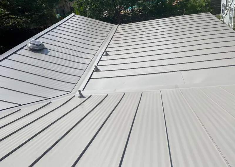 Solar attic fan installed on a metal roof for Roof Ventilation in Wylie
